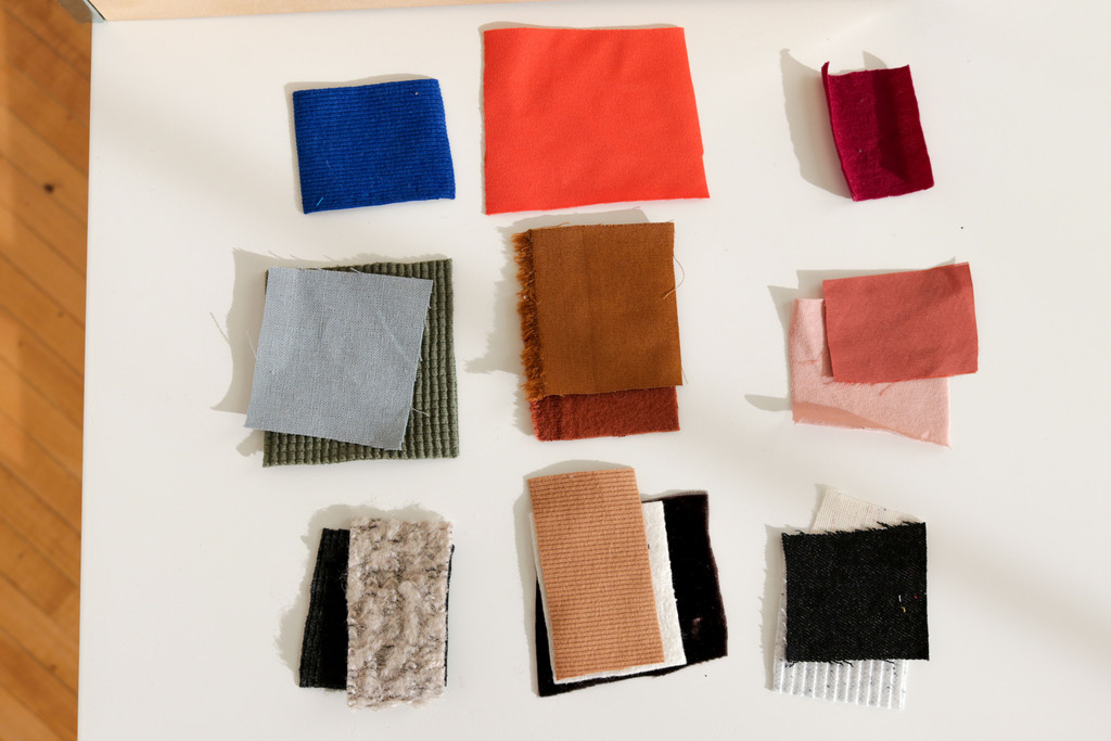 a bunch of fabric swatches on a table