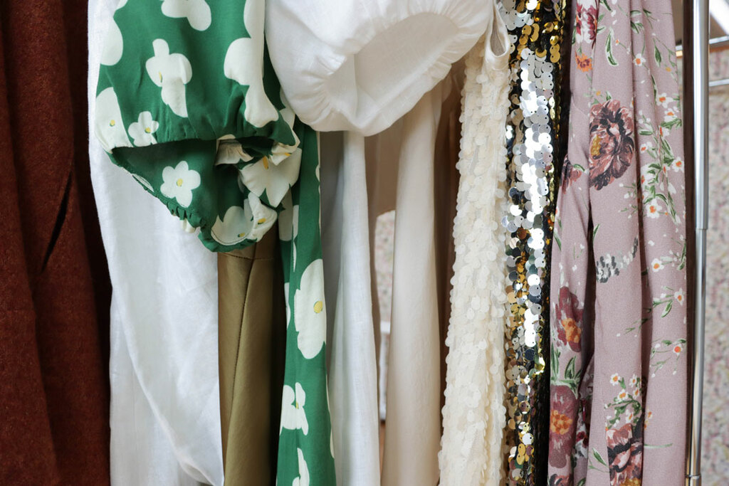 beautiful fabrics hanging on a rack