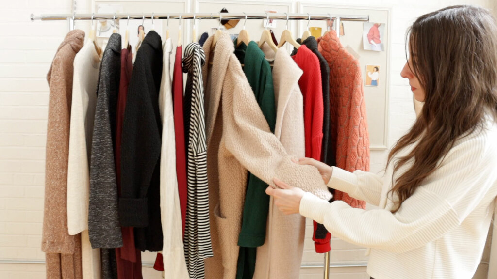 a rack of sweater knit cardigans, jackets, and coats