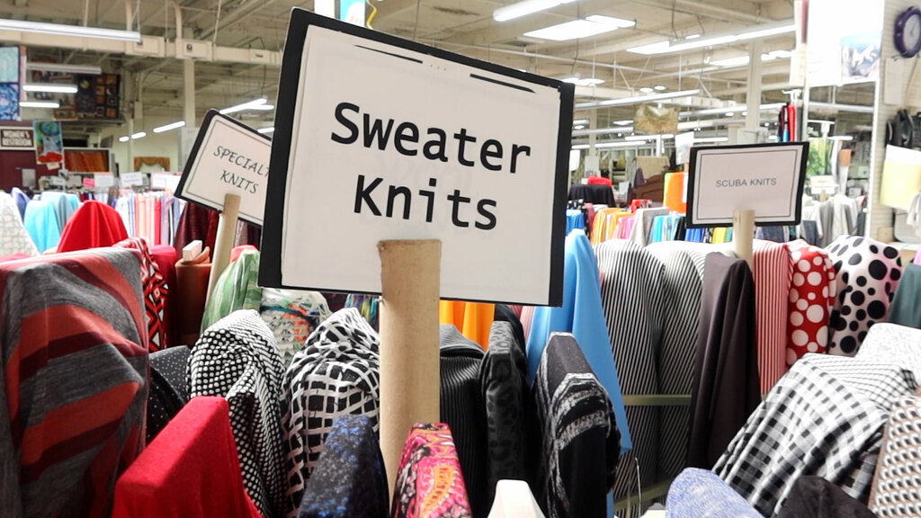 bolts of sweater knits in a fabric store